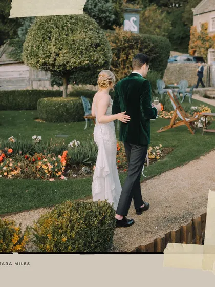 An artistic shot of the couple walking through the manicured gardens, capturing the elegance and romance of their special day.