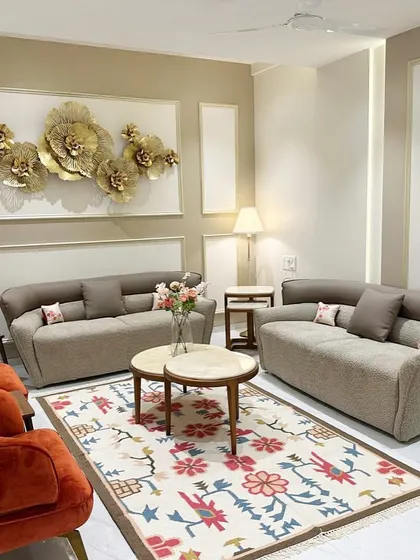 For this South Mumbai residence, we crafted a living space that balances contemporary elegance with inviting warmth. The custom rug, plush upholstery in terracotta and taupe, and curated wall art create a sophisticated yet comfortable family haven.
