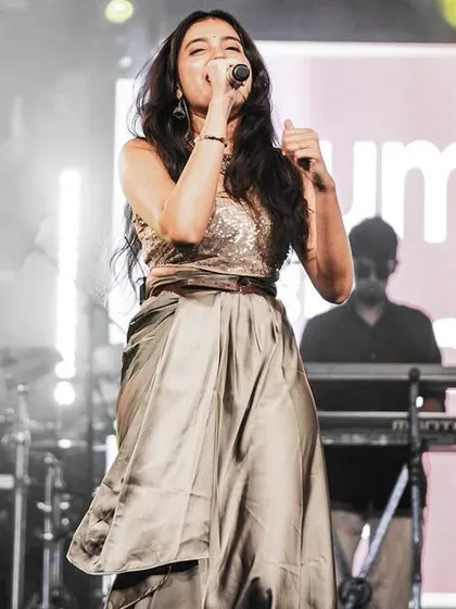 A candid moment captured during my live performance at Forum South Bengaluru. It's moments like these, lost in the song, that I live for.