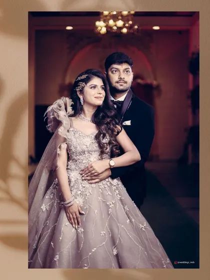 An elegant portrait of the engaged couple, framed by floral graphics for a soft, romantic touch.