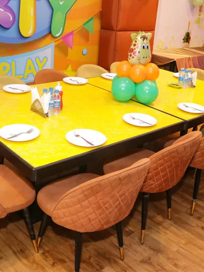 I provide a dedicated and decorated dining area for birthday parties, with tables set up for the little guests to enjoy their meal.