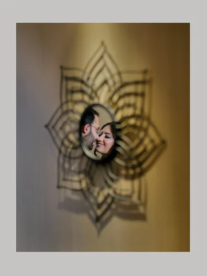 Sometimes the most creative shots happen spontaneously. Using a decorative mirror, I framed this couple's reflection to create an artistic and intimate portrait that feels like a secret glimpse into their world.