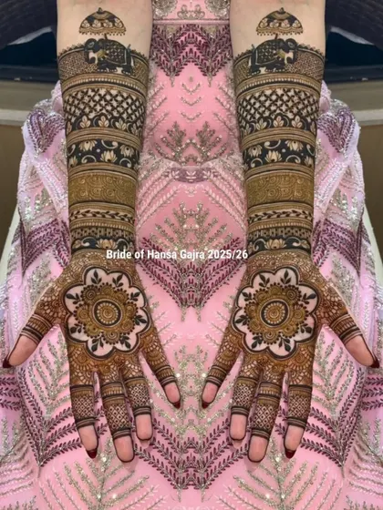 This design is a celebration of traditional motifs. The palms feature a floral mandala, while the arms are adorned with royal elephants under a chatri (umbrella), symbolizing grandeur.