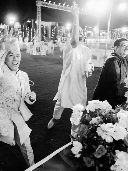 The groom's friends and family dancing with full energy. I love capturing the unrestrained joy of the wedding party.