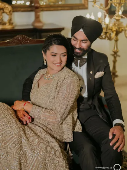 A cozy moment between the couple. Her makeup is soft and romantic, perfect for these intimate photos.
