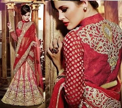 A classic red bridal lehenga with a high-neck, full-sleeve blouse. I pay close attention to the back embroidery and overall silhouette to create a timeless and regal look.