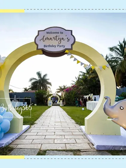 The grand entrance to Amartya's outdoor party. Guests were welcomed through a large yellow arch, with a cute elephant prop and a stone pathway leading to the celebration.