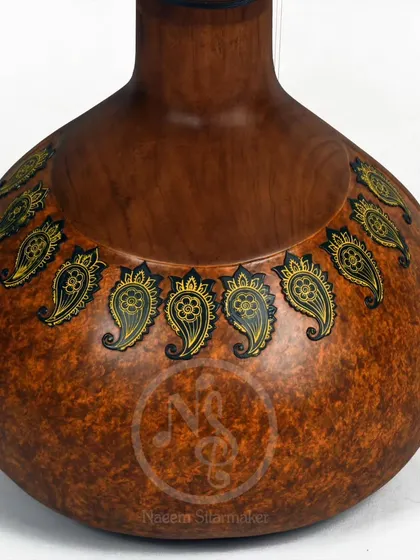 The back of the Zen+ sitar, showing a simple but elegant hand-painted paisley design on the gourd.