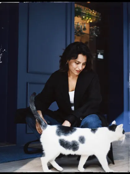 Another sweet interaction from the same series, capturing the gentle nature of both the person and the animal.
