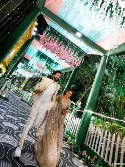 A low-angle shot that makes the couple and the decor look grand and impressive. It’s a creative perspective that adds a unique touch to the wedding album.