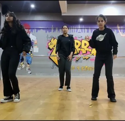 Another shot of our senior girls performing the "Brown Munde" routine. Their all-black outfits add to the powerful and sleek vibe of the choreography.