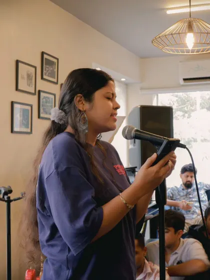 A student vocalist sharing her talent during an open performance day. The support from the audience makes all the difference in building a performer's confidence.