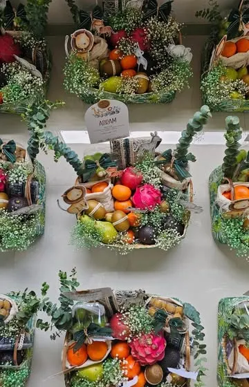Freshness and elegance are captured in this fruit basket to welcome a little one. I used animal cutouts, fresh florals, and custom jute potlis to create a beautiful and healthy gift for the new family.
