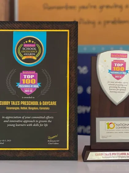 The Brainfeed School Excellence Award and Top 100 Preschools of India plaque. These accolades represent our unwavering commitment to excellence in early childhood education.