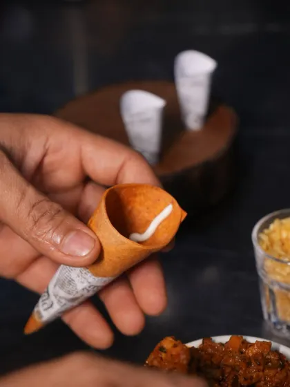 The preparation of our cornetts begins with a swirl of mousse at the bottom, a hidden surprise that adds to the complexity of this seemingly simple bite.