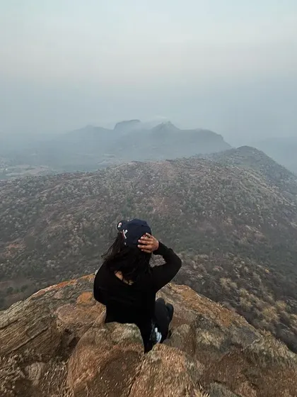 A moment of solitude and reflection at the peak. Beyond team building, our treks offer individuals a chance to disconnect and recharge.