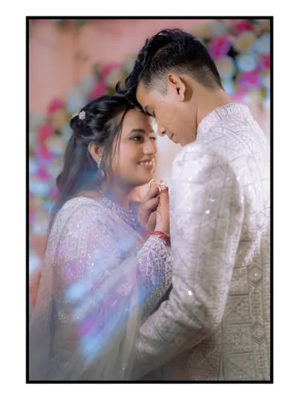 A dreamy, romantic portrait with a prism effect creating rainbow light flares. This technique adds a touch of magic and artistry to the couple's engagement photo.