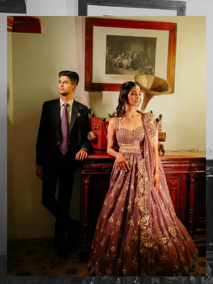 A stylish couple portrait taken during the Sangeet. We create designated photo corners with vintage props and beautiful lighting for those perfect, magazine-worthy shots.