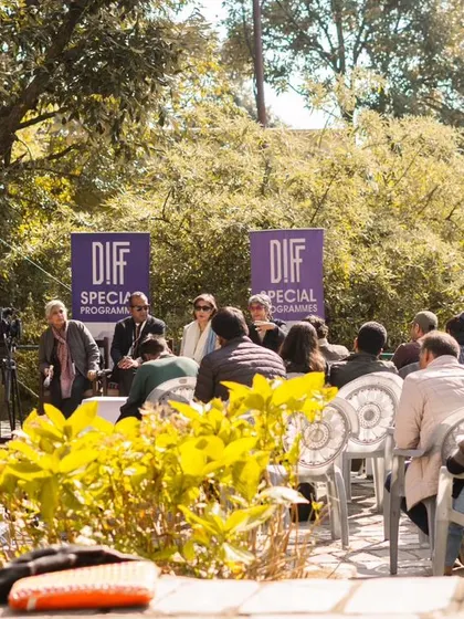 Event coverage isn't just about the main stage; it's also about the quieter, more focused moments. This photo of an outdoor panel discussion at a film festival shows my ability to document talks and presentations in a natural and engaging way.