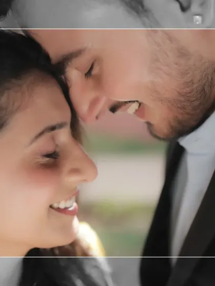 A beautiful close-up shot that captures the raw emotion and laughter between Hiren and Sakshi. This image is a perfect example of capturing the 'in-between' moments that feel most real.