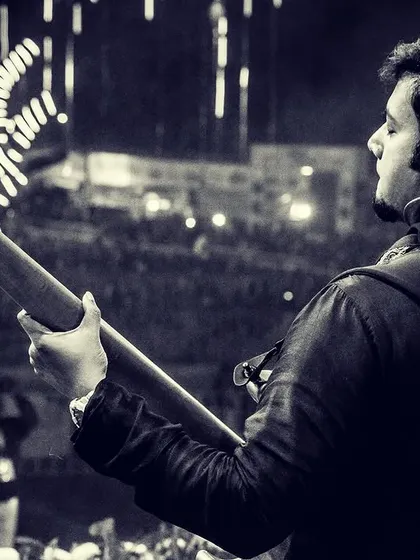 A powerful black and white shot of our bassist from behind, looking out at the massive crowd at Parab Festival.
