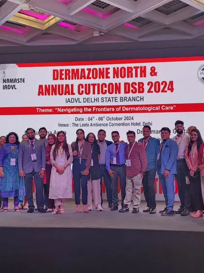 A group photo with the dedicated team and participants on stage at the Dermazone North conference. The success of such events is always a collaborative effort.