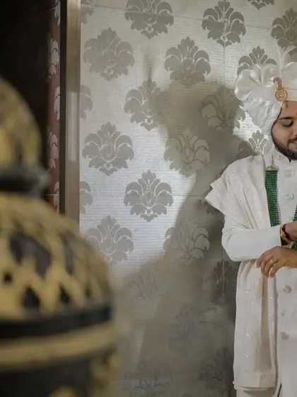 A classic groom's portrait, capturing a moment of quiet reflection before the ceremony.