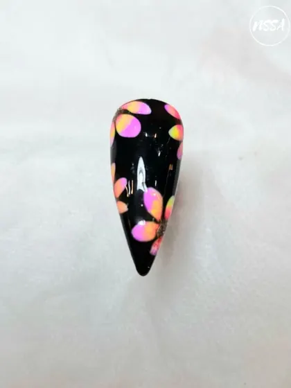 This vibrant, abstract dotting art on a black base is a great example of student creativity. They learn to play with color and pattern to create bold designs.