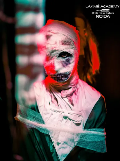 A motion-blur shot of the mummy, adding to the horror effect. This demonstrates creative photography techniques to enhance the impact of the makeup.