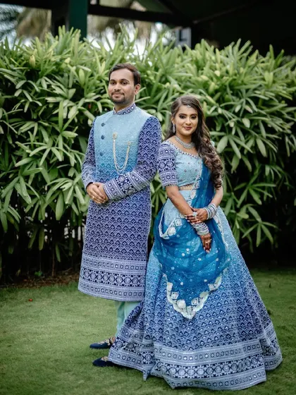 Celebrating love with our beautiful couple, who chose to coordinate in our custom-designed blue lehenga and sherwani set. We love creating matching outfits that make your big day even more memorable.