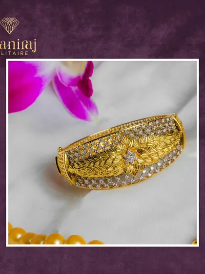 This handcrafted gold kada is a masterpiece of detail. The intricate floral carving is surrounded by sparkling diamonds, creating a piece that feels both traditional and luxurious.