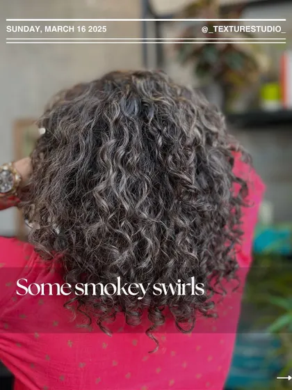 Some smokey swirls for your timeline. This is a unique grey-blending technique on curly hair, creating a cool, modern, and dimensional look.