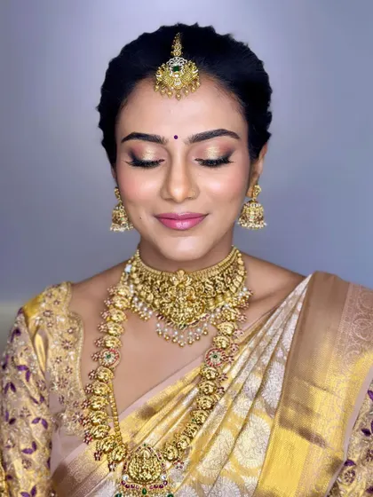 A detailed look at the soft, shimmering eyeshadow and perfectly blended skin for this South Indian bridal makeup.