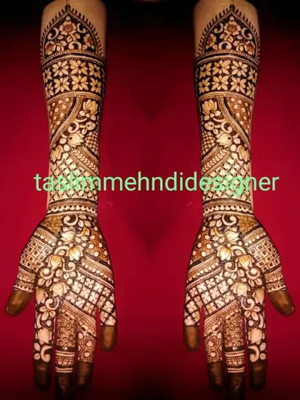 This elaborate bridal design is perfect for the bride who wants maximum coverage. The pattern is dense with floral and geometric work, creating a stunning sleeve of henna from the fingers to the elbow.