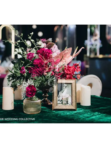 Every detail was curated to fit the theme, from the rich green velvet tablecloths to the custom floral centerpieces and elegant animal portrait frames on each table. These elements demonstrate our commitment to creating a cohesive and immersive experience.
