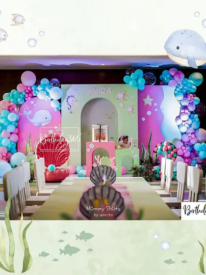 A duplicate of image 8, showing the full setup for Avira's underwater-themed 2nd birthday party.