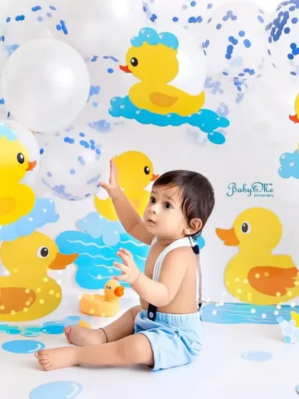 This rubber ducky bath time theme is one of the cutest for a first birthday. The blue and yellow colors are so cheerful, and the balloons add a touch of party fun.