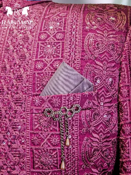 A detailed shot of the pocket on the magenta Jodhpuri, complete with a striped pocket square and a custom brooch.