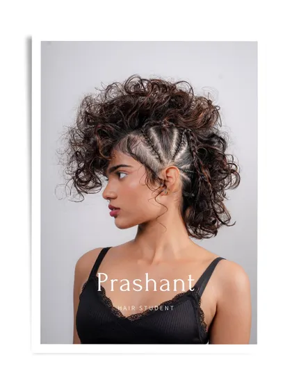 A professional portfolio shot of hair student Prashant's creative curly mohawk, ready to impress.