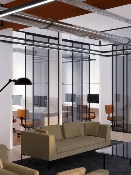 A view showing the relationship between the lounge area and the glass-enclosed private offices. This design provides both open, collaborative zones and quiet, focused spaces.