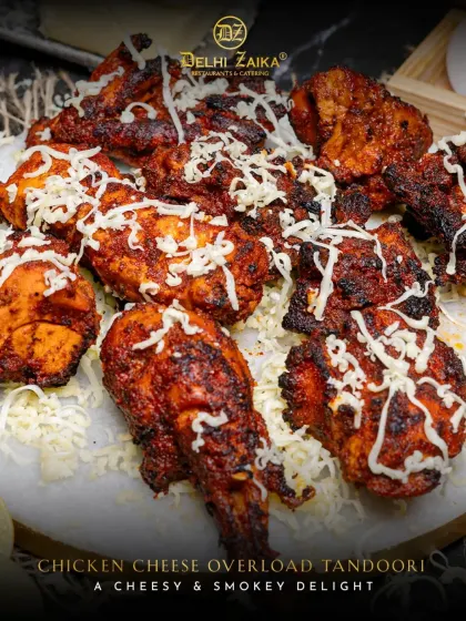 Presenting our Chicken Cheese Overload Tandoori. We take juicy, smoky tandoori chicken and drench it in a generous layer of molten cheese. This is pure indulgence, a cheesy and smoky delight that's become a crowd favorite.