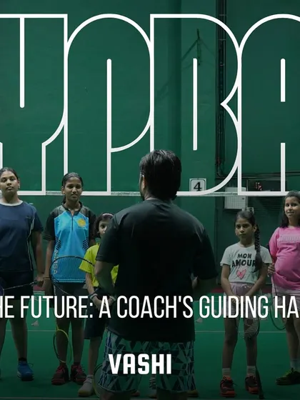 Mentoring the future at our Vashi center. A coach's guiding hand is essential in shaping a player's career.