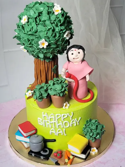 A cake for a mother who loves gardening, teaching, and cooking. I loved incorporating all her passions into this one personalized design.