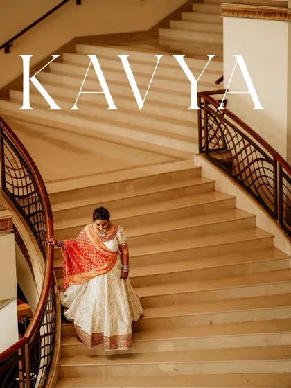 A bride descending a grand staircase, the picture of elegance. This shot uses the architectural lines and her graceful movement to create a stunning and classic bridal portrait.