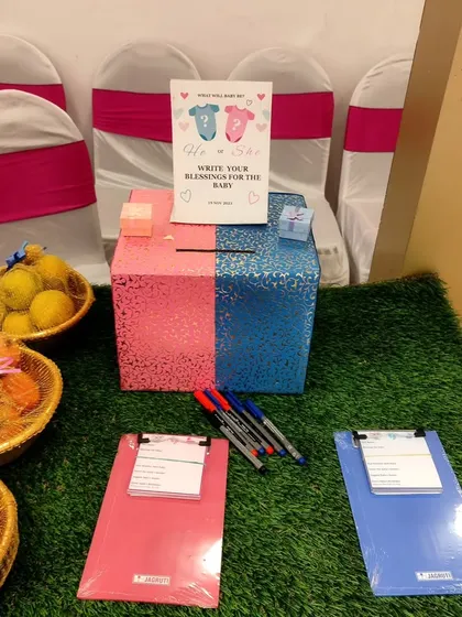 A 'Blessings for the Baby' box is a heartfelt activity. Guests can write their wishes for the little one, creating a precious collection of notes for the parents to read.