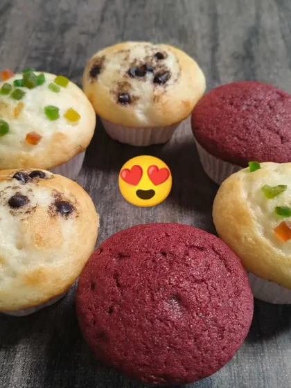 Chocolate chip, fruit-studded and red velvet muffins appear together in this display of the muffin varieties we offer.