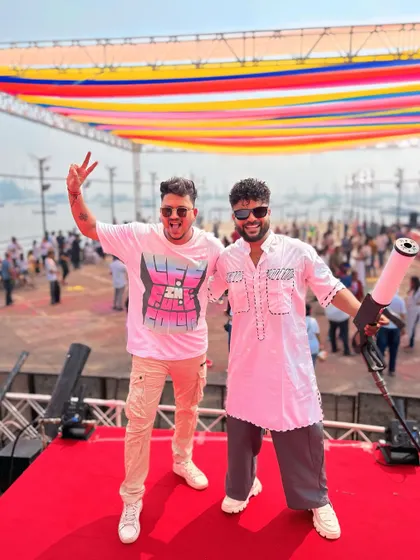 Posing with a color gun at a Holi party. I'm always ready for the colorful chaos.