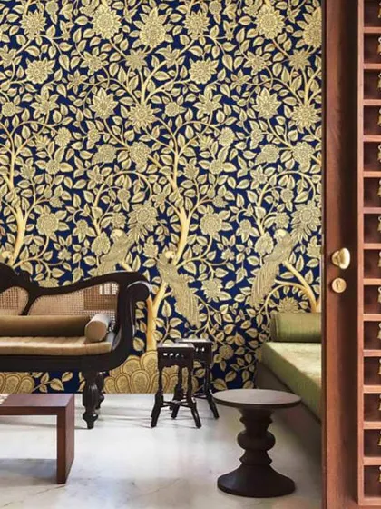 This is the kind of grandeur we bring to your walls. A design from our Prakriti collection, featuring the traditional Tree of Life motif in stunning gold on a deep blue base, creating a truly royal and welcoming atmosphere in this living space.