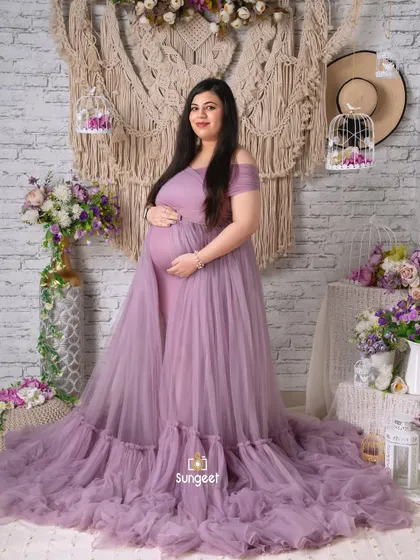 A classic full-length portrait in our lavender tulle gown, set against a rustic white brick and macrame backdrop.