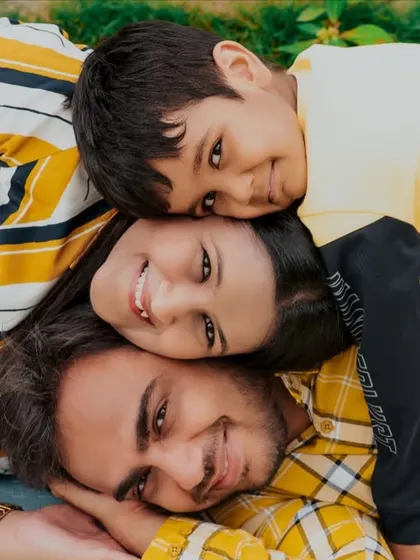 Family photos should be fun, not formal. I love capturing genuine connection, like this playful family stack, which shows their unique bond and happy energy during our outdoor session.
